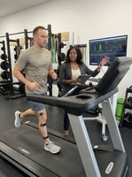 Patient working with a physical therapist during running gait analysis at a performance physical therapy clinic in Winter Garden, FL